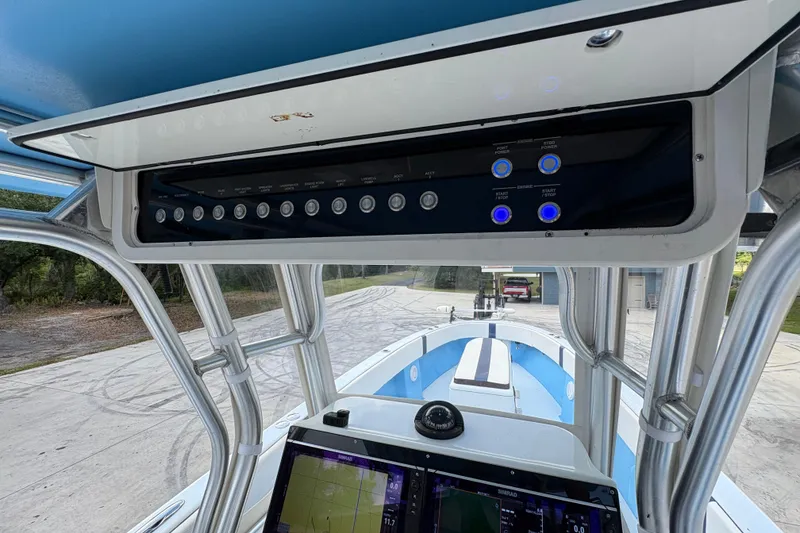Slide: The Image of Control panel of a 2018 Catamaran Coaches 38 Lightning boat, featuring navigation equipment. - 42