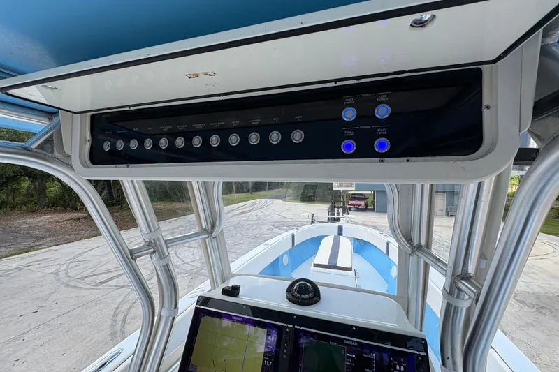 Slide: The Image of Control panel of a 2018 Catamaran Coaches 38 Lightning boat, featuring navigation equipment. - 43