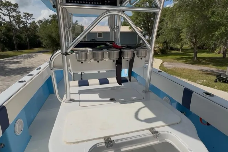 Slide: The Image of 2018 Catamaran Coaches 38 Lightning boat interior with rod holders and seating. - 44