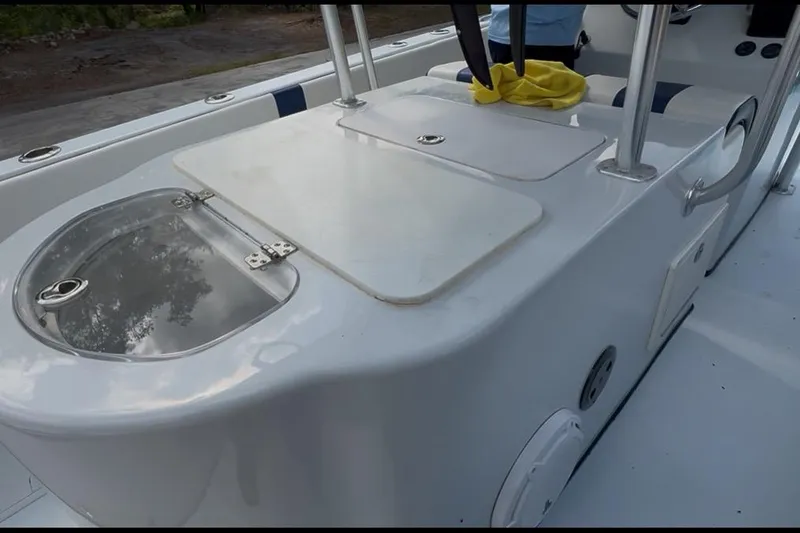Slide: The Image of 2018 Catamaran Coaches 38 Lightning boat deck with storage compartments and seating. - 51