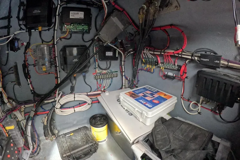 Slide: The Image of Electrical system inside a 2018 Catamaran Coaches 38 Lightning boat, featuring wiring and equipment. - 54