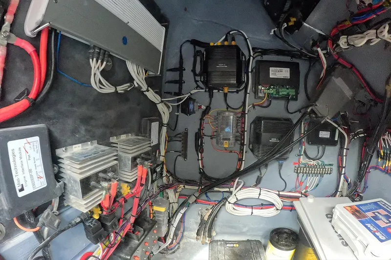 Slide: The Image of Electrical system setup in a 2018 Catamaran Coaches 38 Lightning boat, featuring organized wiring and components. - 55