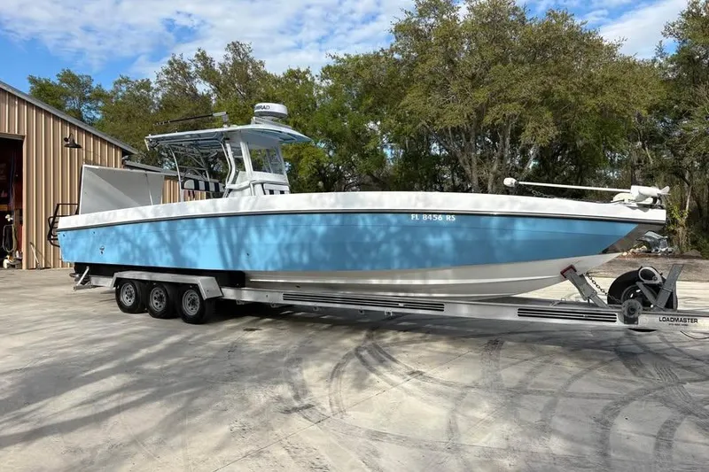 The Image of 2018 Catamaran Coaches Lightning Powerboats on trailer, parked outdoors near a building. - 0