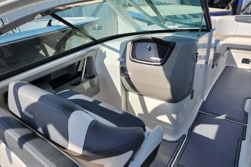 Slide: The Image of 2019 Robalo R317 Dual Console interior with seating and storage compartments. - 12