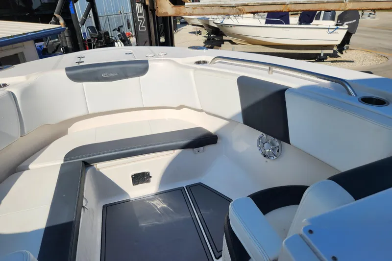 Slide: The Image of 2019 Robalo R317 Dual Console boat interior with seating and speaker. - 16
