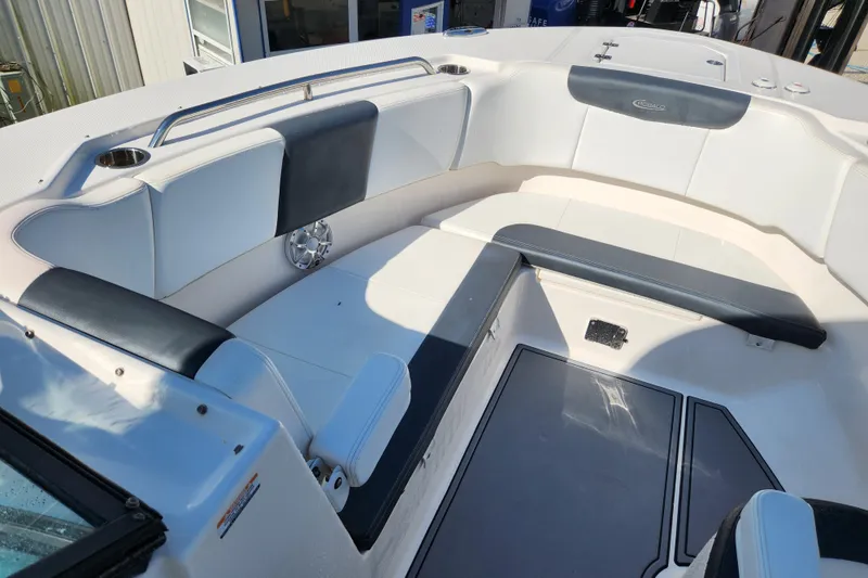 Slide: The Image of 2019 Robalo R317 Dual Console boat interior with cushioned seating and sleek design. - 17