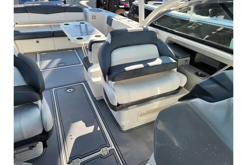 Slide: The Image of 2019 Robalo R317 Dual Console boat interior with seating and table. - 20
