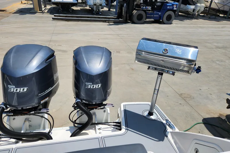 Slide: The Image of 2019 Robalo R317 Dual Console with twin Yamaha 300 engines and a Magma grill. - 34