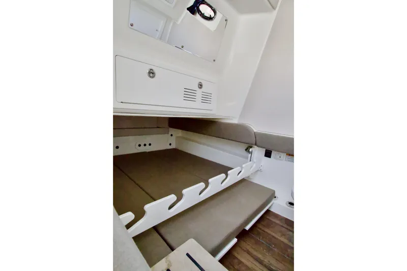 Slide: The Image of 2026 Regulator 35 cabin interior with cushioned seating and storage compartments. - 10