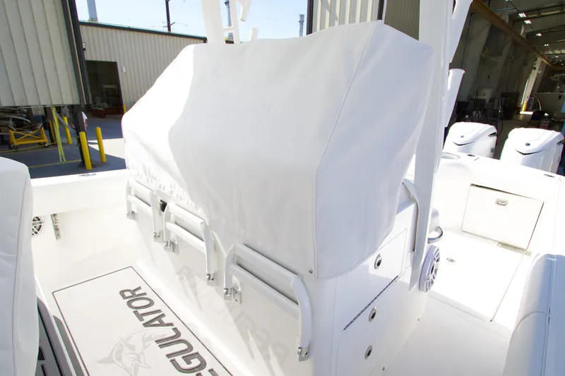 Slide: The Image of 2026 Regulator 35 boat interior with covered seating and storage compartments. - 2