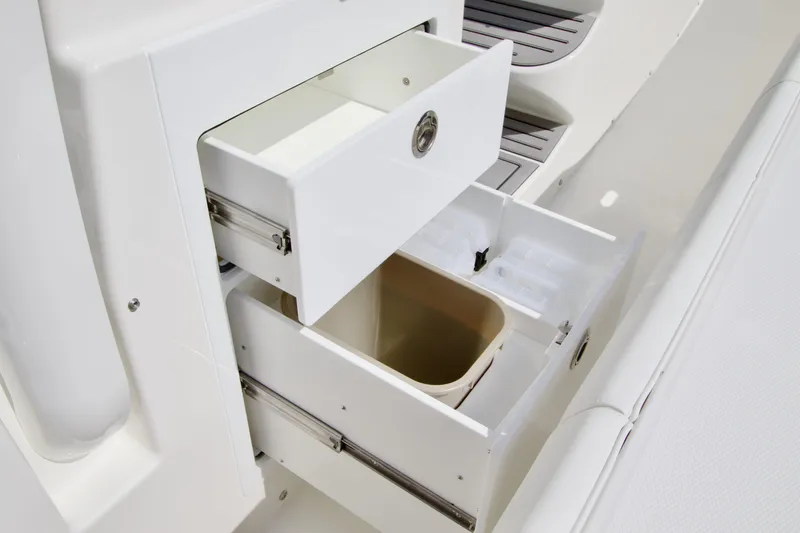 Slide: The Image of Open storage drawers on a 2026 Regulator 35 boat, showcasing organized compartments. - 21