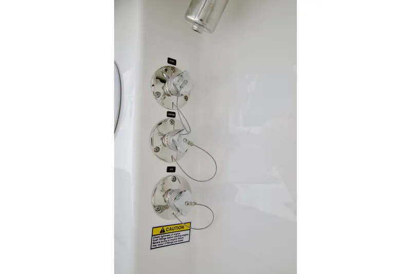 Slide: The Image of 2026 Regulator 35 boat fuel connectors with caution label. - 23