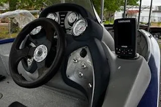 Slide: The Image of 2017 Tracker Pro Team 175 TF boat dashboard with steering wheel and fish finder. - 5