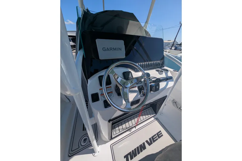 Slide: The Image of 2024 Twin Vee 240 GFX CC boat dashboard with Garmin navigation system. - 5