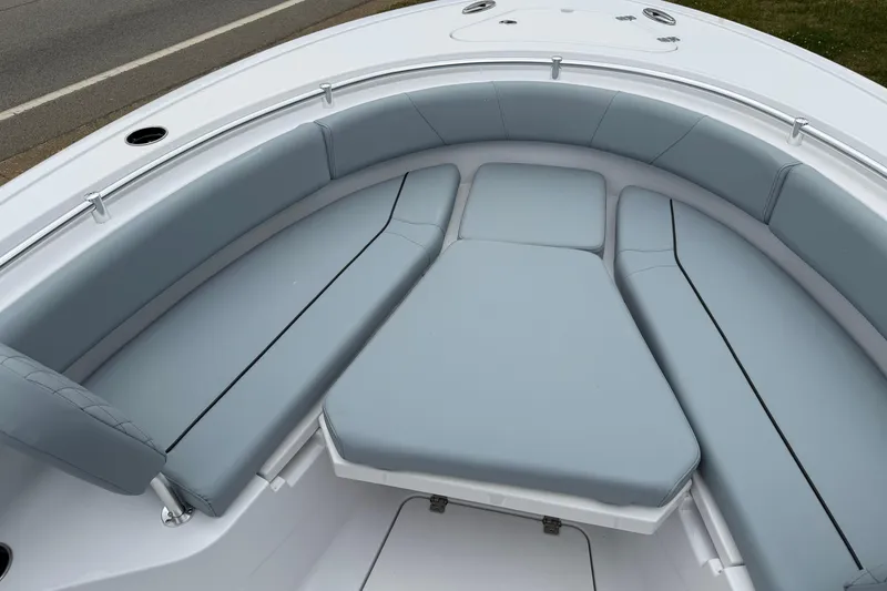 Slide: The Image of 2026 Sportsman Open 232 Center Console boat with cushioned seating area. - 10