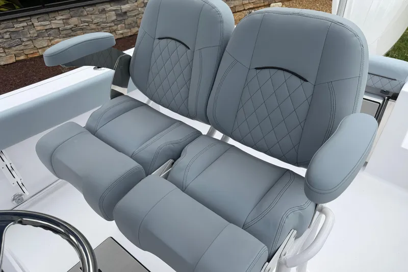 Slide: The Image of Luxurious seating on 2026 Sportsman Open 232 Center Console boat with quilted design. - 11