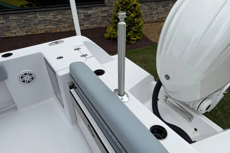Slide: The Image of 2026 Sportsman Open 232 Center Console boat interior with motor and seating. - 14