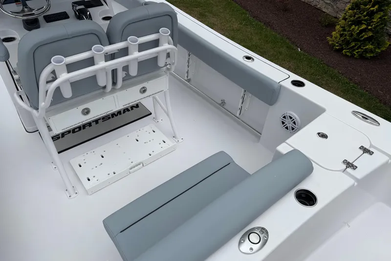 Slide: The Image of 2026 Sportsman Open 232 Center Console boat interior with seating and rod holders. - 16