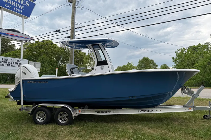Slide: The Image of 2026 Sportsman Open 232 Center Console boat on trailer, displayed outdoors. - 3