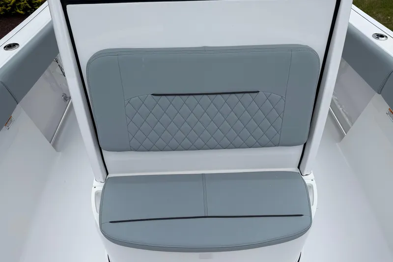 Slide: The Image of 2026 Sportsman Open 232 Center Console boat seat with quilted gray upholstery. - 7