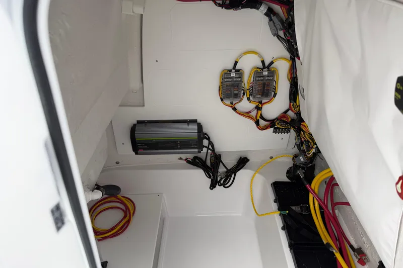 Slide: The Image of Electrical wiring and components inside a 2026 Sportsman Open 232 Center Console boat. - 8