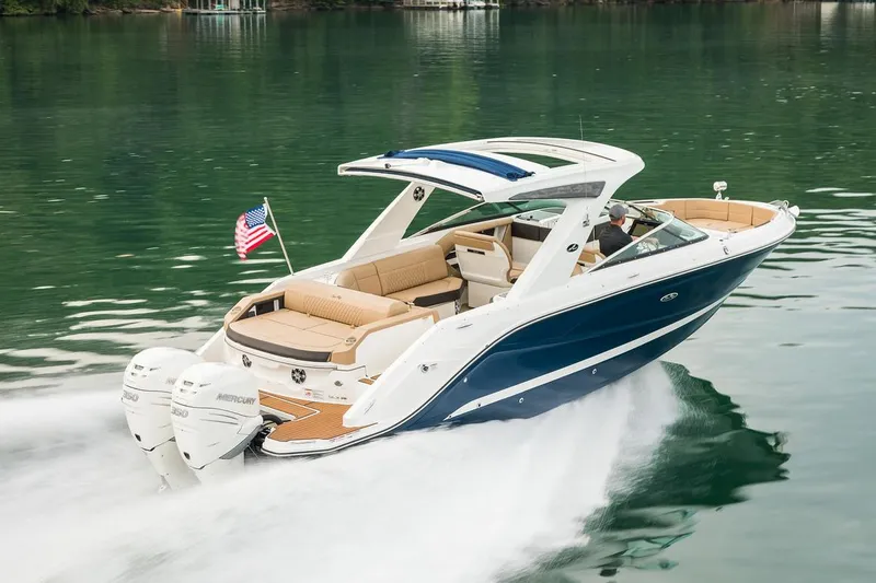The Image of Manufacturer Provided Image: 2022 Sea Ray SLX 310 OB cruising on a lake with dual outboard engines. - 0