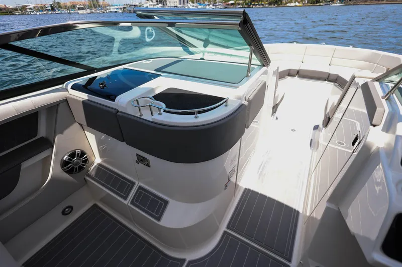 Slide: The Image of 2022 Sea Ray SLX 310 Outboard boat interior with sleek design and spacious seating. - 16