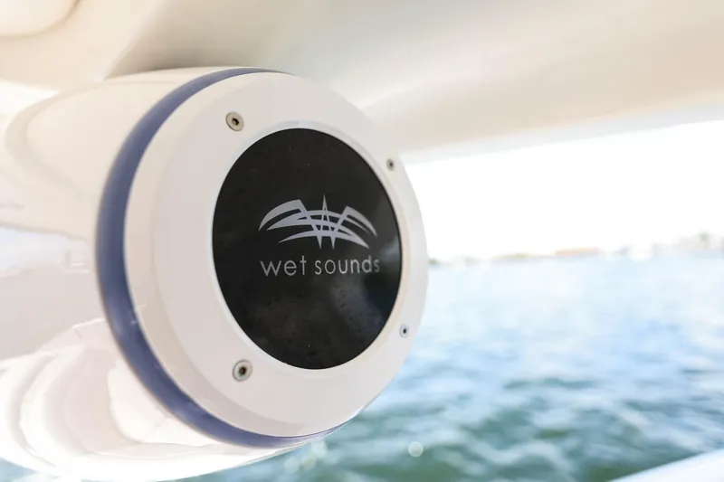 Slide: The Image of Wet Sounds speaker on 2022 Sea Ray SLX 310 Outboard, overlooking water. - 24