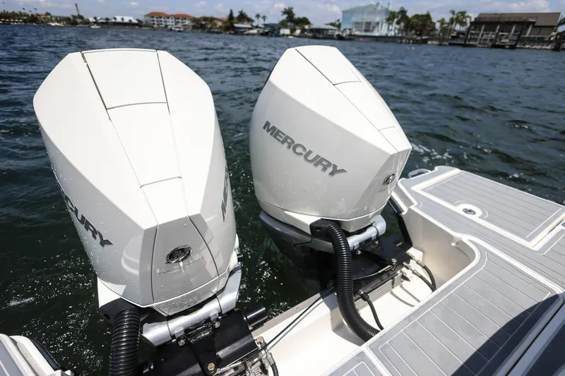 Slide: The Image of 2022 Sea Ray SLX 310 Outboard with dual Mercury engines on water. - 35