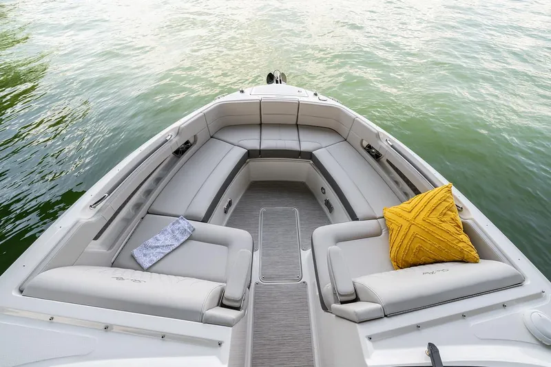 Slide: The Image of Manufacturer Provided Image: 2022 Sea Ray SLX 310 OB boat with spacious seating and decorative pillows. - 5