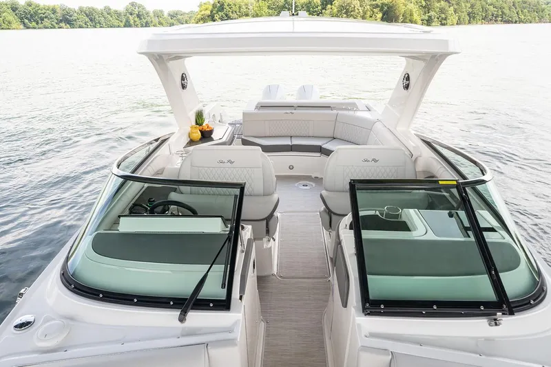 Slide: The Image of Manufacturer Provided Image: 2022 Sea Ray SLX 310 OB luxury boat interior on a serene lake. - 6