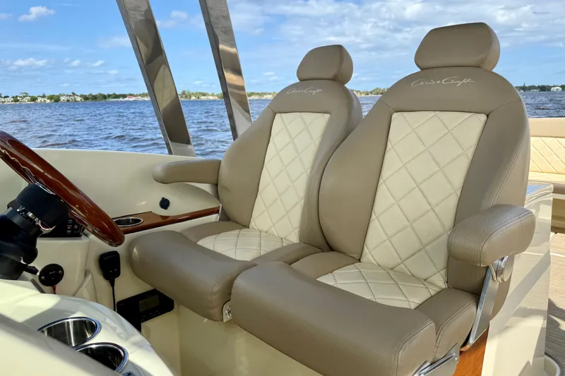 Slide: The Image of 2023 Chris-Craft Calypso 30 boat interior with luxurious beige leather seats. - 9