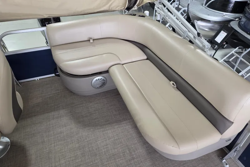 Slide: The Image of 2023 Sun Tracker Bass Buggy 16 XL pontoon boat seating area with beige upholstery. - 7
