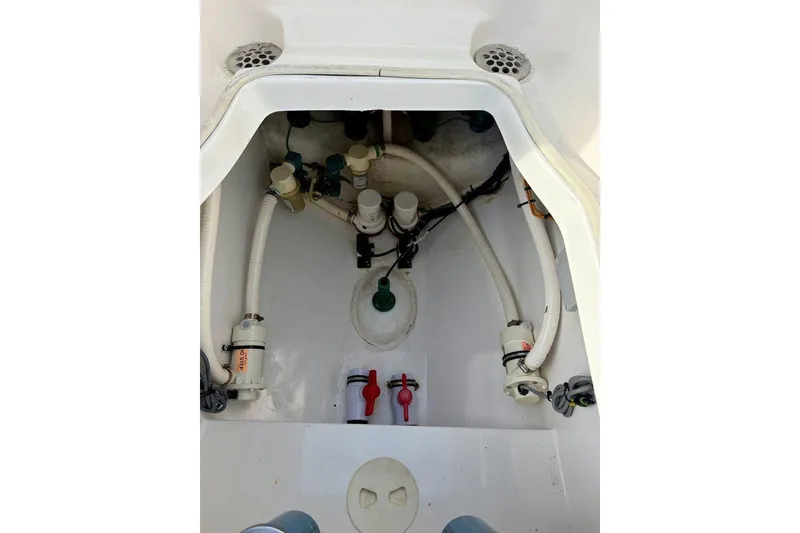 Slide: The Image of 2009 SeaHunter 29 Center Console bilge area with hoses and fittings. - 14