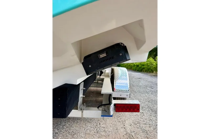 Slide: The Image of 2009 SeaHunter 29 Center Console boat on trailer, rear view with visible transom and light. - 4
