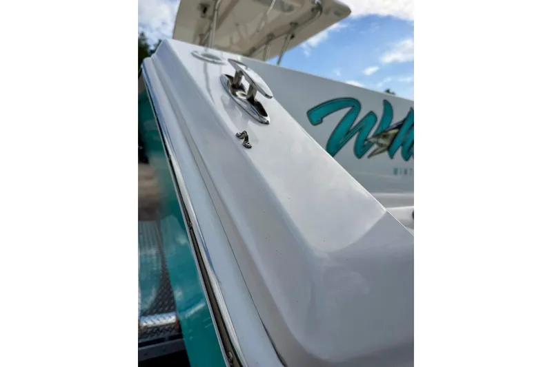 Slide: The Image of Close-up of a 2009 SeaHunter 29 Center Console boat, showcasing sleek design details. - 5