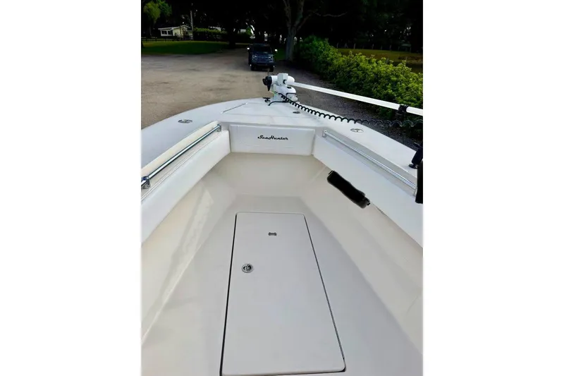 Slide: The Image of 2009 SeaHunter 29 Center Console boat with spacious deck and sleek design. - 7