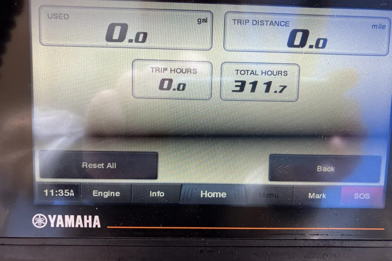Slide: The Image of Yamaha display showing 311.7 total hours on a 2019 Grady-White Freedom 235 boat. - 18