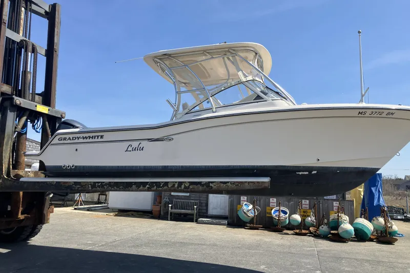 Slide: The Image of 2019 Grady-White Freedom 235 boat on forklift, outdoor setting. - 19