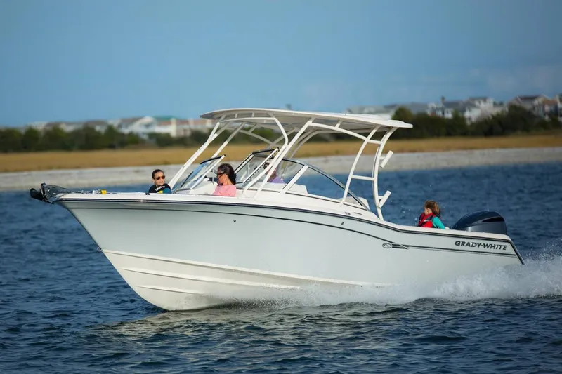 Slide: The Image of Manufacturer Provided Image: 2019 Grady-White Freedom 235 boat cruising on water with passengers. - 24