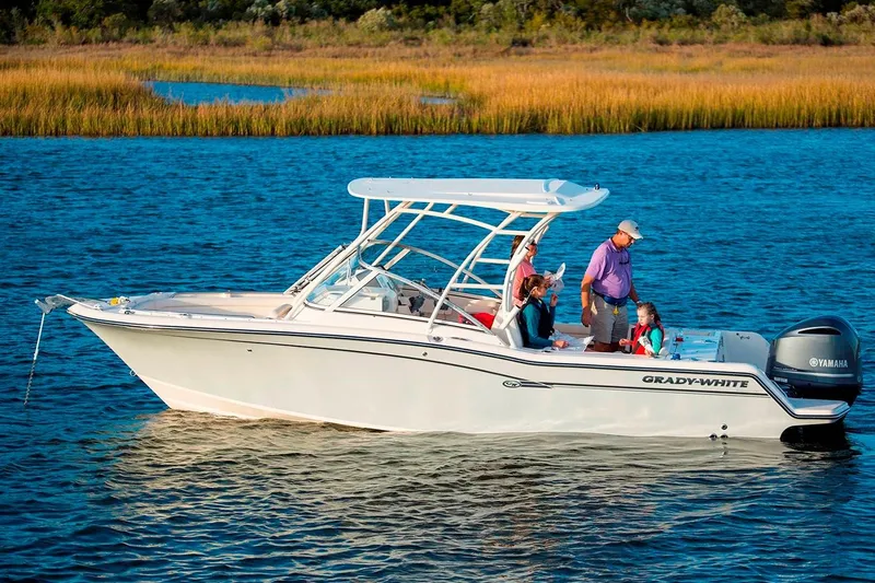 Slide: The Image of Manufacturer Provided Image: 2019 Grady-White Freedom 235 boat cruising on a lake with passengers. - 25