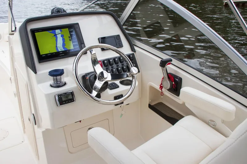 Slide: The Image of Manufacturer Provided Image: 2019 Grady-White Freedom 235 boat helm with navigation system and controls. - 31