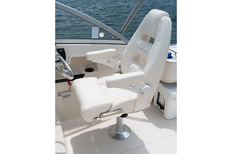 Slide: The Image of Manufacturer Provided Image: 2019 Grady-White Freedom 235 captain's chair with armrests on boat deck. - 32