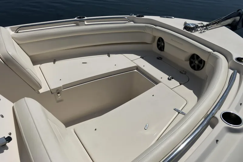 Slide: The Image of 2019 Grady-White Freedom 235 boat interior with spacious seating and storage compartments. - 9