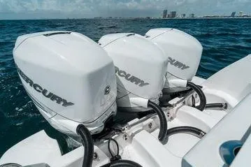 Slide: The Image of 2022 Intrepid 407 Nomad FE with triple Mercury outboard engines on open water. - 19