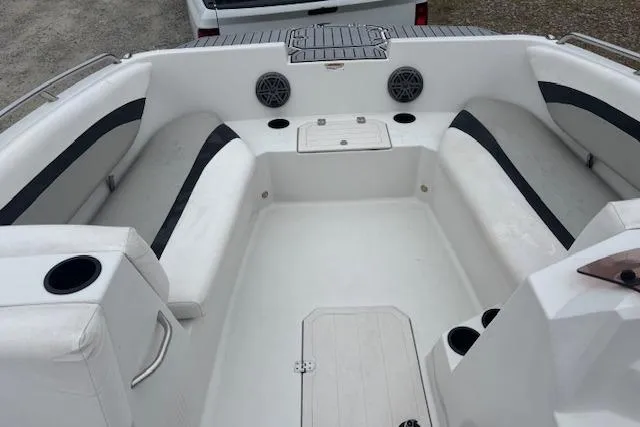 Slide: The Image of 2021 Starcraft SVX 171 OB boat interior with white seating and cup holders. - 11