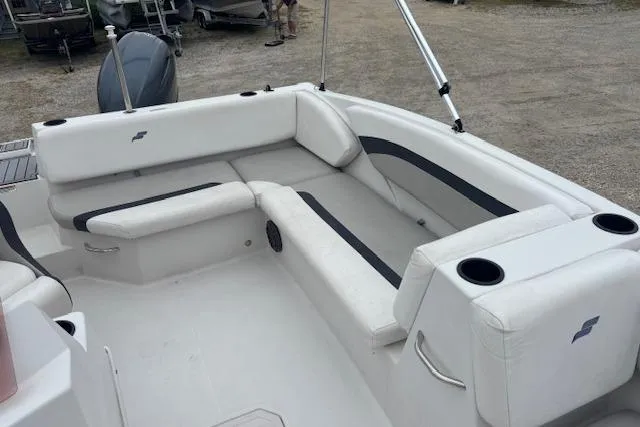 Slide: The Image of 2021 Starcraft SVX 171 OB boat interior with white seating and cup holders. - 12