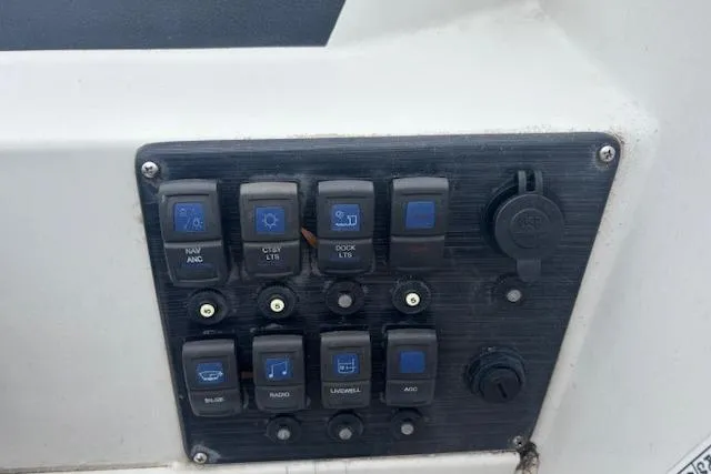Slide: The Image of Control panel of a 2021 Starcraft SVX 171 OB boat with labeled switches. - 16