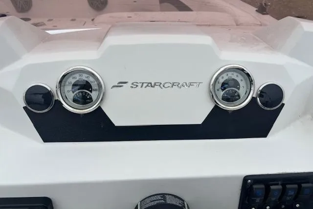 Slide: The Image of Dashboard of 2021 Starcraft SVX 171 OB boat with gauges and logo. - 18