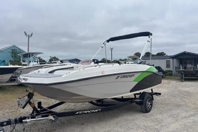 Slide: The Image of 2021 Starcraft SVX 171 OB boat on trailer, parked outdoors. - 5